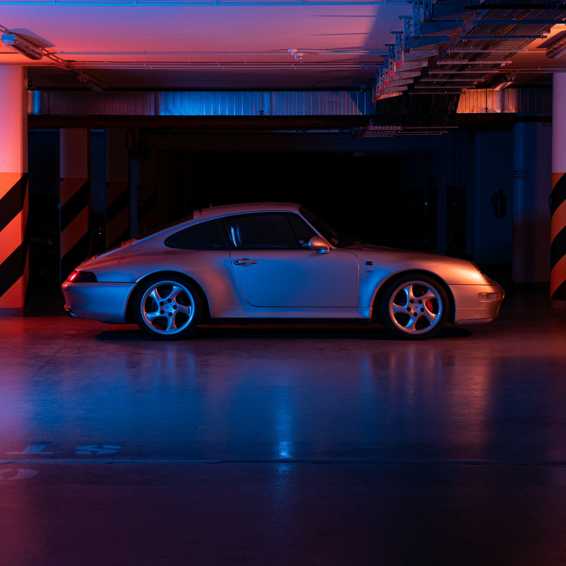 this is a picture of an exotic car parked on an epoxy floor