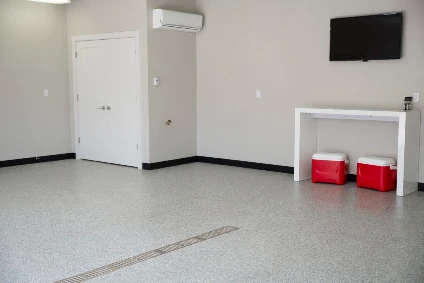 This is a light colored epoxy floor in a garage 